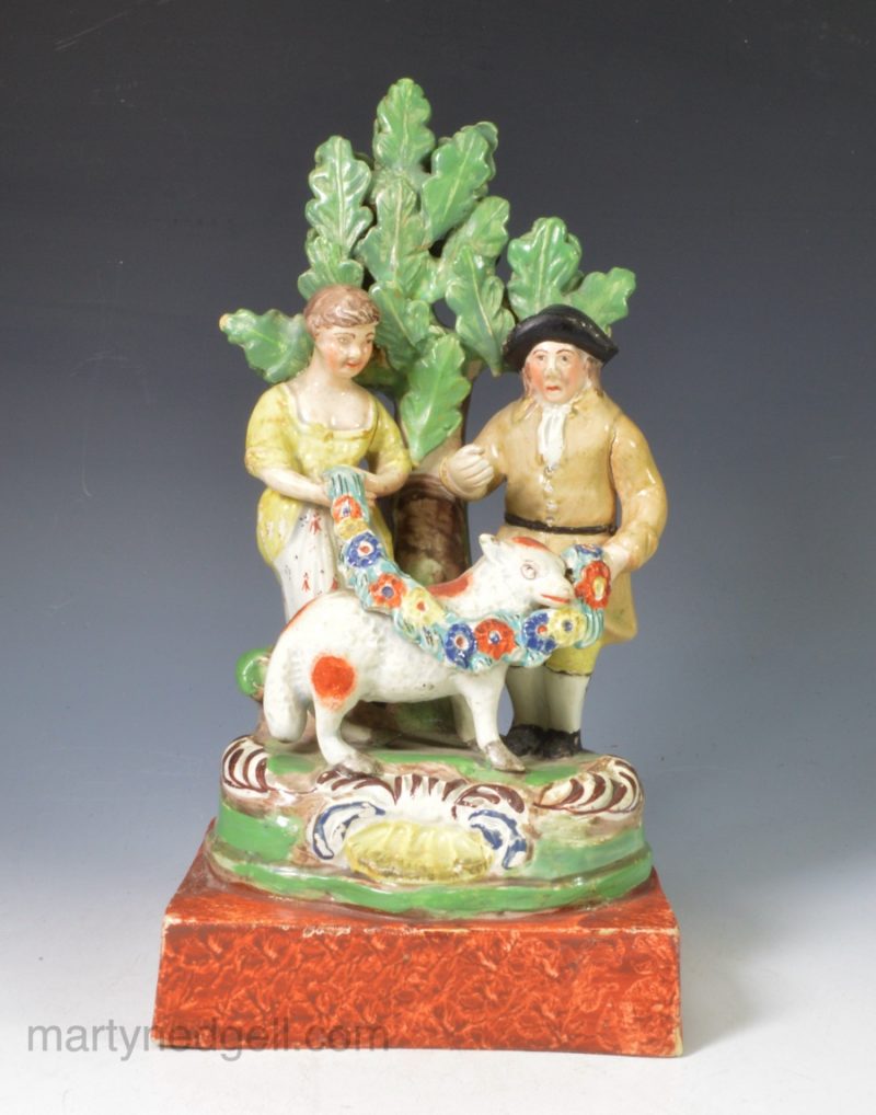 Staffordshire pearlware bocage figure of a couple with their prize sheep, circa 1820