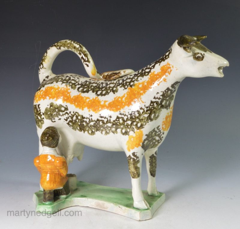 Prattware pottery cow creamer with hobbled legs, circa 1820