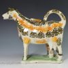 Prattware pottery cow creamer with hobbled legs, circa 1820