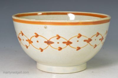 Pearlware pottery tea bowl decorated with underglaze enamels, circa 1810