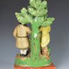 Staffordshire pearlware bocage figure of a couple with their prize sheep, circa 1820