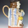 Pearlware pottery Toby Jug decorated with underglaze enamels, circa 1820