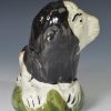 Pearlware pottery lion decorated with underglaze enamels, circa 1820