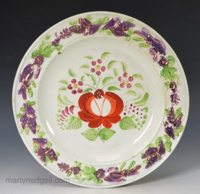 Small pearlware pottery plate decorated with overglaze enamels and pink lustre, circa 1820
