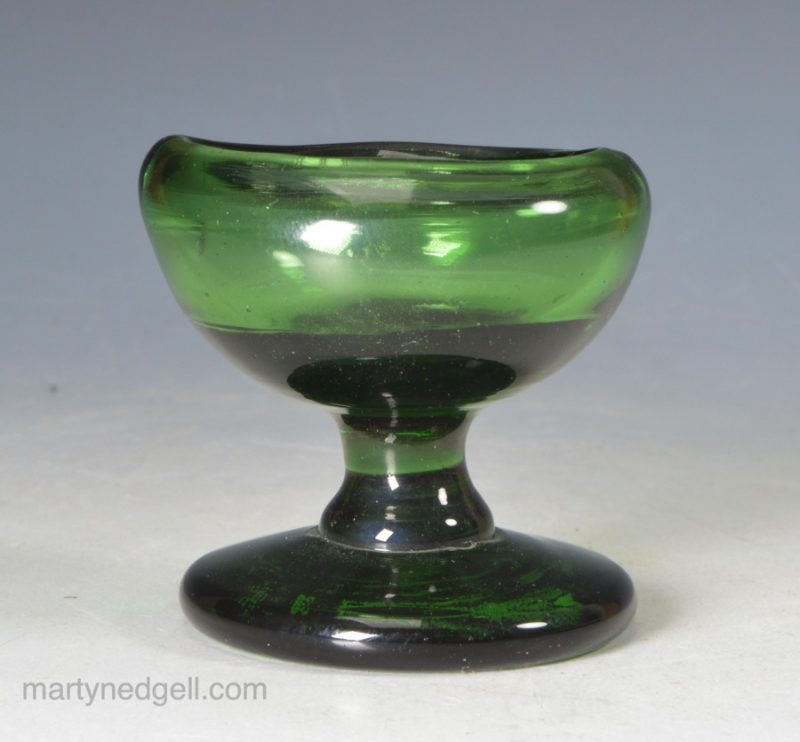 Small green blown glass eye bath, circa 1850