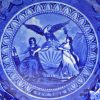 Pearlware pottery plate transfer printed in blue with the arms of New York, circa 1820