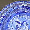 Pearlware pottery plate transfer printed in blue with the arms of New York, circa 1820
