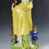 Large Staffordshire pearlware figure of the Widow and Orphans, circa 1820