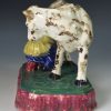 Scottish pearlware figure of a cow and milkmaid, circa 1820