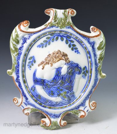 Prattware pottery plaque moulded with a Classical weeping lady, circa 1800