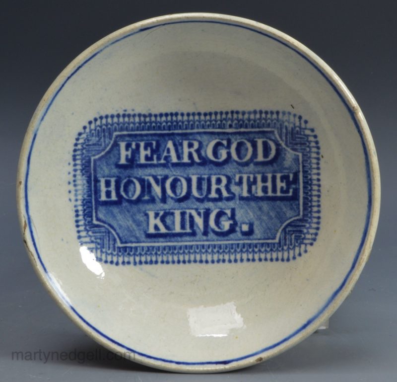 Pearlware pottery saucer decorated with underglaze transfer "Fear God Honour the King", circa 1820