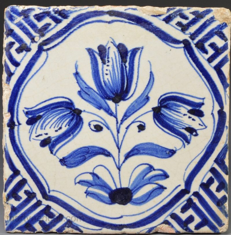 Dutch Delft tile decorated in blue with Wan Li type corners, circa 1650