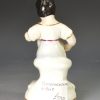 Staffordshire porcelain figure of a young girl and her cat, circa 1840