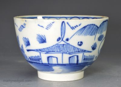 Pearlware pottery teabowl decorated with blue under the glaze, circa 1790