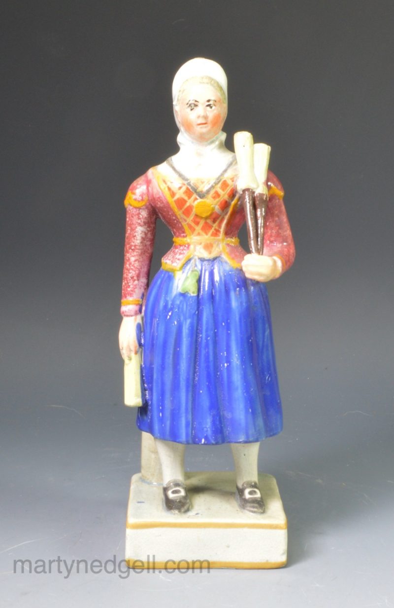 Staffordshire pearlware figure of the Broom Girl, circa 1820