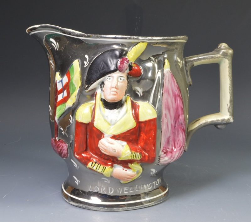 Pearlware pottery jug moulded with Lord Wellington and General Hill and decorated with silver lustre, circa 1815