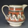 Small pearlware pottery jug decorated with mocha snail trail, circa 1830