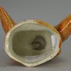 Pearlware stirrup cup decorated with high fired enamels under the glaze, circa 1820