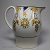 Pottery serving jug decorated with high fired enamels under a pearlware glaze (Prattware), circa 1820