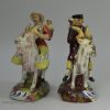 Pair of Staffordshire pearlware figures of the Welsh tailor and his wife, circa 1820