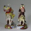 Pair of Staffordshire pearlware figures of the Welsh tailor and his wife, circa 1820