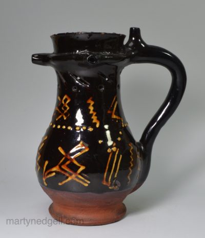 Slipware pottery puzzle jug, circa 1740