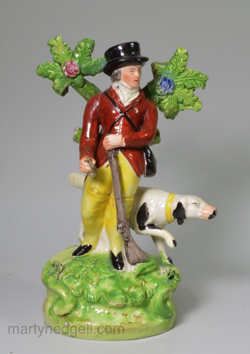 Staffordshire pearlware pottery bocage figure of a huntsman, circa 1820