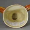 Creamware pottery fox head stirrup cup decorated with underglaze enamels, circa 1800