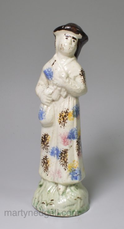 Pearlware pottery figure decorated with high fired enamels under the glaze, circa 1790