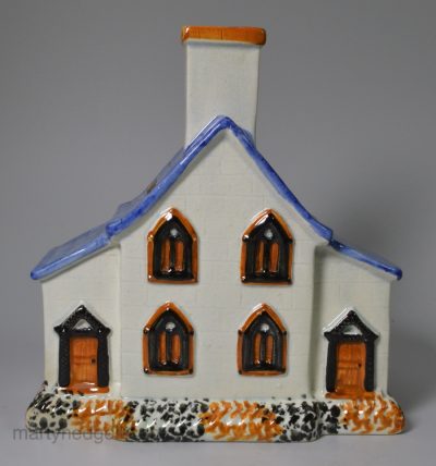 Yorkshire type pearlware pottery house money bank decorated with high fired enamels under a pearlware glaze, circa 1820