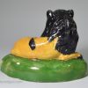 Pottery lion decorated with high fired enamels under a pearlware glaze, circa 1820, possibly Scottish or North East pottery
