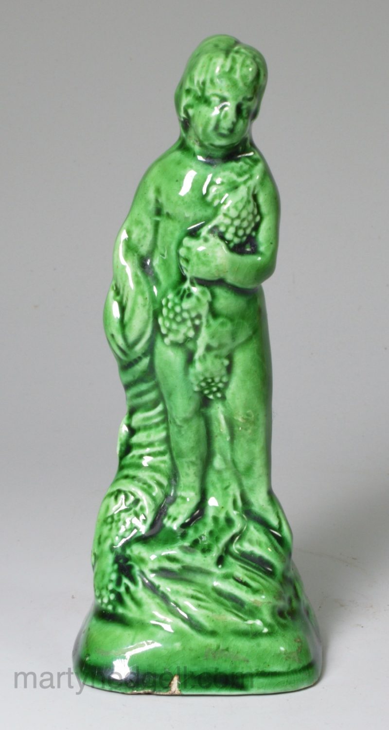 Green glaze pottery figure of Bacchus, circa 1800