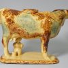 Yellow bodied pottery cow creamer, circa 1860