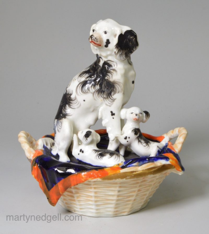 Staffordshire porcelain spaniel and pups, circa 1840