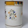 Prattware pottery quart tankard decorated with high fired enamels under a pearlware glaze, circa 1820