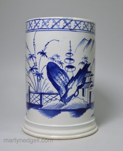 Pearlware pottery quart tankard decorated in underglaze blue, circa 1800