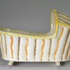 Prattware pottery toy cradle decorated with high fired enamels under a pearlware glaze, circa 1820