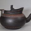 Staffordshire black basalt teapot with encaustic decoration, circa 1790, with a fake Wedgwood mark