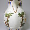 Prattware pottery jug moulded with Offerings to Peace and grooms drinking and decorated with high fired enamels under a pearlware glaze, circa 1800