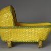 Canary yellow pottery toy cradle, circa 1820