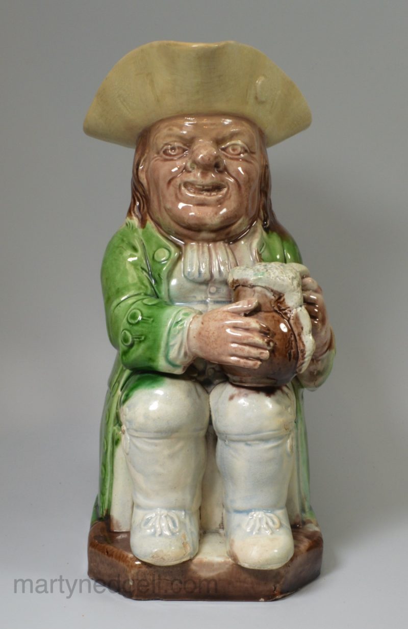Ralph Wood type creamware pottery Toby jug decorated with coloured glazes, circa 1790
