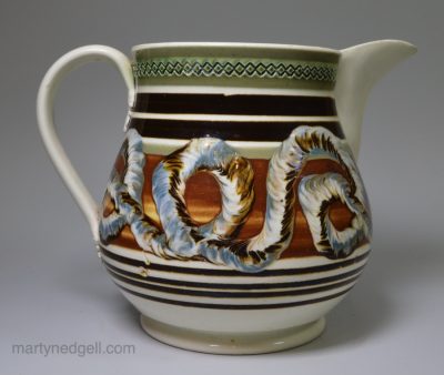 Pearlware pottery jug with mocha snail trail decoration, circa 1820