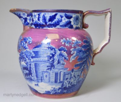 Pearlware pottery jug decorated with blue transfer under the glaze and pink lustre, circa 1820
