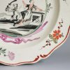 Creamware pottery plate decorated in Holland with the Dutch Maiden, circa 1780