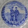 Small pearlware pottery child's plate printed with "British Rifle Volunteers", circa 1859