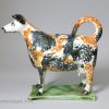 Prattware pottery cow creamer decorated with high fired enamels under a pearlware glaze, circa 1820