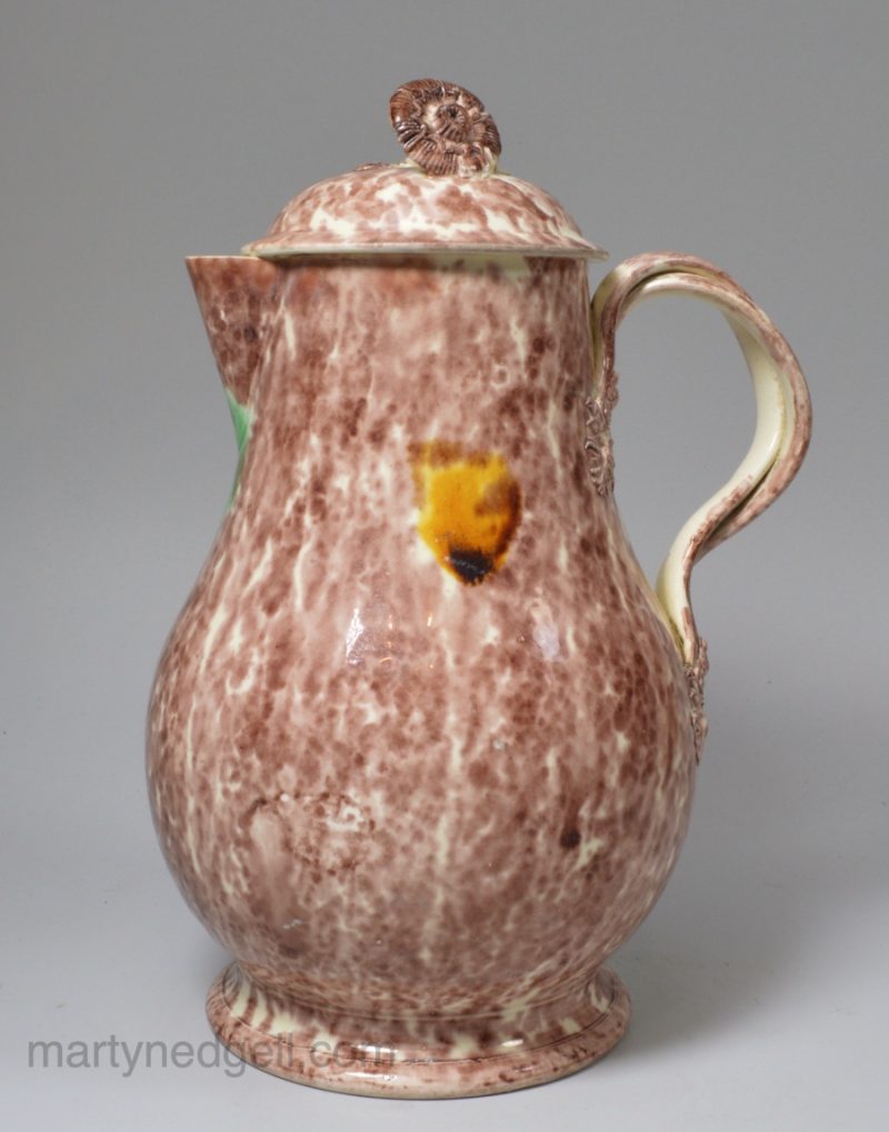 Creamware pottery jug and lid decorated with Whieldon type coloured glazes, circa 1770