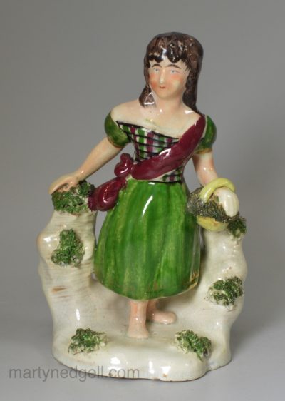 Pottery figure of a girl, circa 1830, probably Scottish