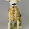 Pearlware pottery cow creamer decorated with underglaze enamels, circa 1820