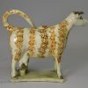 Pearlware pottery cow creamer decorated with underglaze enamels, circa 1820